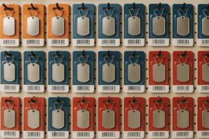 A visually striking display of dog tags packaged in clear plastic blister cards, highlighting their shelf presence and compliant barcode labeling.
