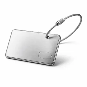 UC Tag airline-style luggage tag made from brushed stainless steel, featuring a beveled edge, split ring attachment, and a subtle blank emblem engraving for a refined look. Presented on a white studio background ideal for e-commerce.