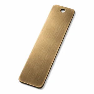 This variant of the Antique Brass Bookmark Tag is made of solid brass with an antique brass finish and a brushed surface texture. It features smooth, rounded corners and a single hole at the top, ideal for adding a tassel or cord.