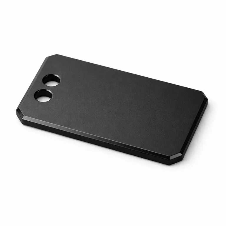 A sleek anodized aluminum bag tag with a matte black finish, modern chamfered edge, and dual holes for flexible attachment. This lightweight yet resilient variant brings a contemporary look to personal or business travel bags.