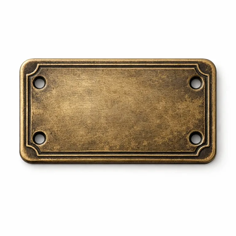 Classic antique brass plated bag tag made of die cast zinc alloy, featuring an embossed border accent and double sewing holes for secure attachment to bags. Antique finish adds a vintage touch.