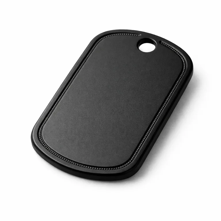 A batch serial number dog tag made from matte finished anodized aluminum, with safe rounded corners and a single hole for chain attachment, featuring etched border details. Photographed in crisp studio lighting against a white backdrop.