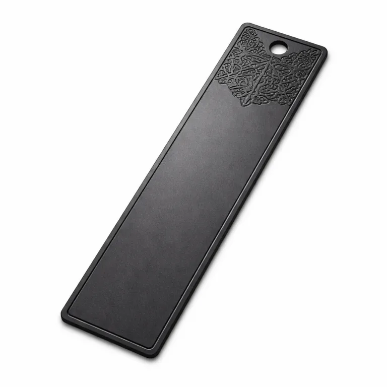 A realistic product photo showing a bookmark tag crafted from matte black anodized aluminum. It features sleek chamfered edges, a smooth matte finish, and a cleanly punched hole, combining contemporary style with lightweight durability.