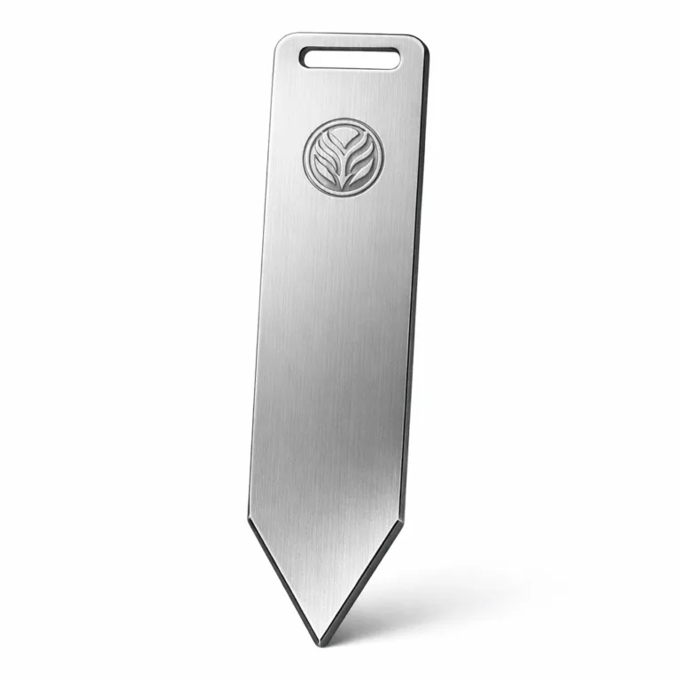 Lightweight bookmark tag in anodized aluminum, showcasing a laser-etched emblem logo and a sleek beveled edge for added refinement. The anodized finish offers durability and a matte metallic sheen.