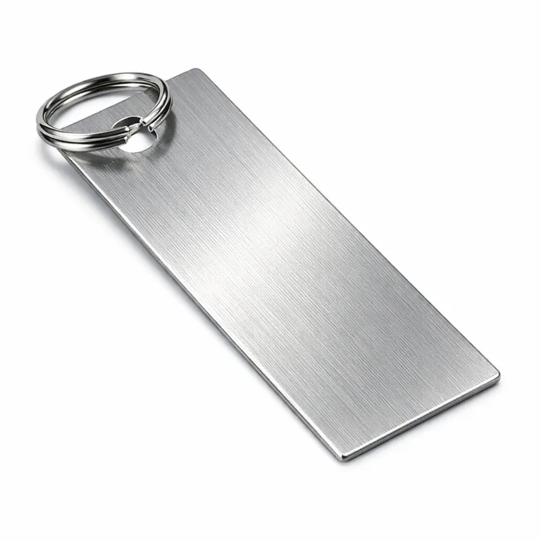 A commercial photo of a rectangular brushed stainless steel bookmark tag featuring a single punched hole and attached split ring. The brushed finish provides subtle texture, and the image captures detailed surface quality suited for e-commerce display.
