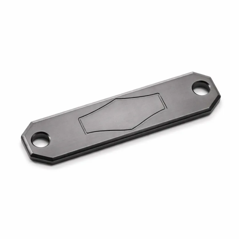 A lightweight matte anodized aluminum bracelet tag plate with stylish beveled edges and a debossed blank emblem. Single holes on either end allow for secure attachment to bracelets. Sleek and modern, perfect for custom engraving.