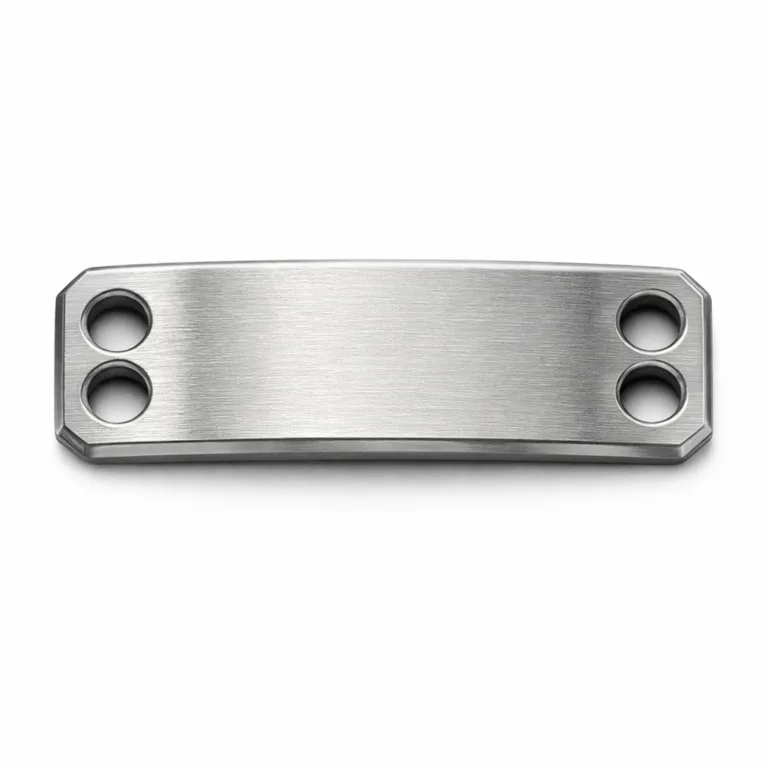 A rectangular bracelet tag crafted from brushed stainless steel with double holes for attachment. The surface features finely brushed lines and a subtly beveled edge. A blank emblem engraving emphasizes the tag’s customizable nature.