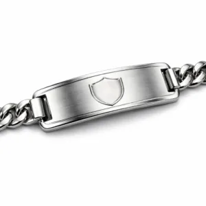 A single bracelet tag made from brushed stainless steel, featuring a polished surface and a blank laser-engraved emblem. The tag has rounded corners and is photographed on a white studio background with high realism and sharp detail.