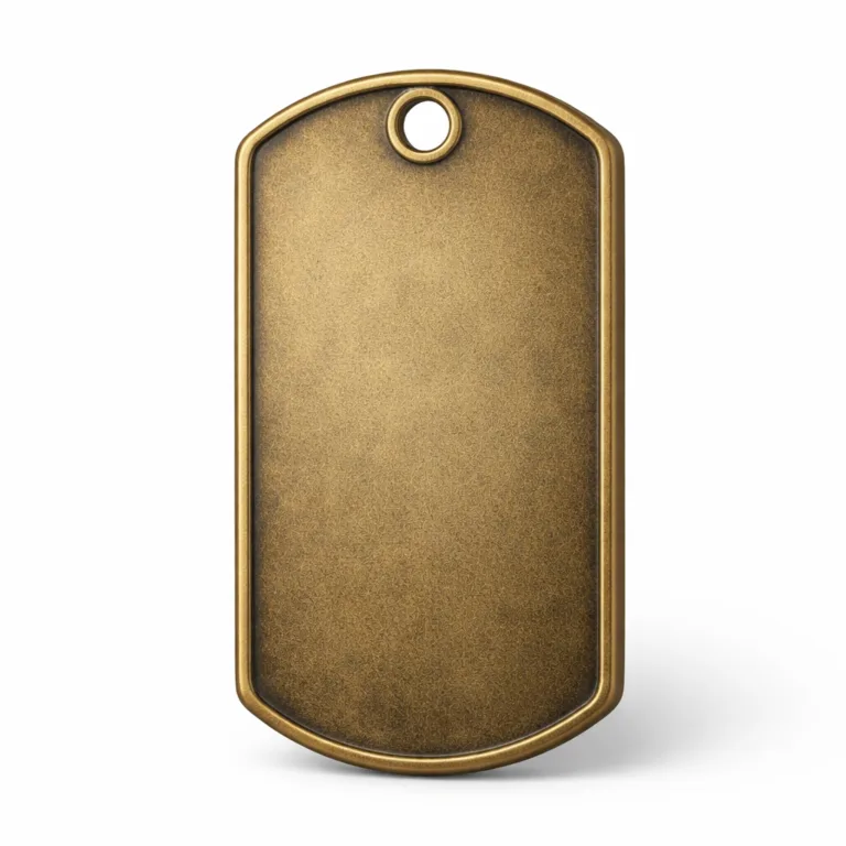 Vintage-inspired military dog tag in antique brass, featuring an embossed surface and chamfered edge, with a single hole for attachment, photographed for e-commerce display.