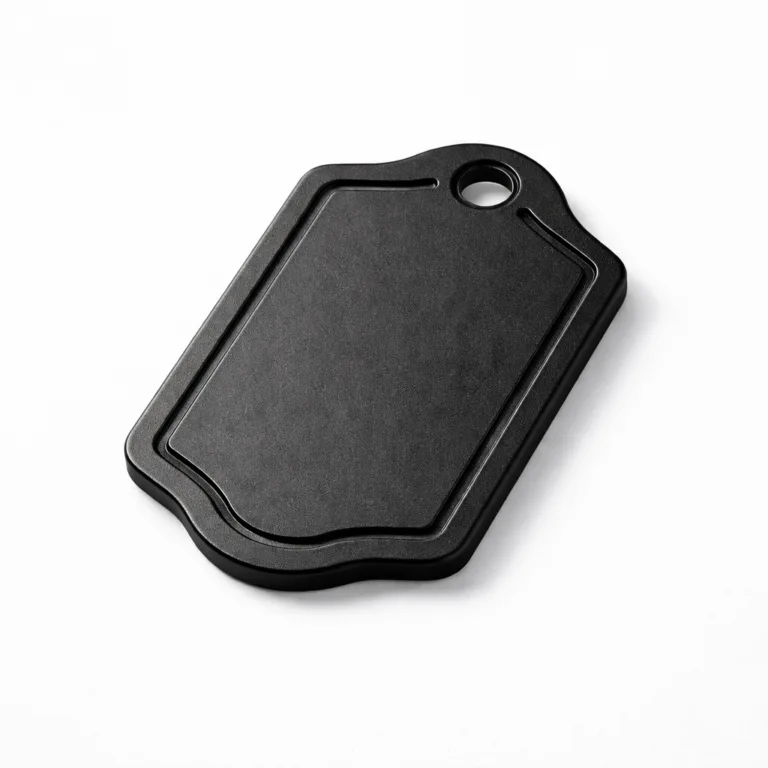 This variant features a die-cut logo tag made from anodized aluminum with a matte black finish. The design includes rounded corners for a modern touch and a debossed emblem shape for clean definition. Suited for sophisticated metal branding needs.
