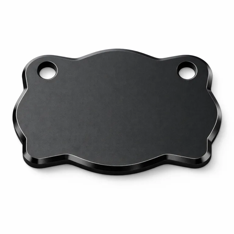A sleek bag tag in matte black anodized aluminum with beveled edges, designed for modern aesthetics. Features two precision-cut holes for secure split ring or chain attachment.