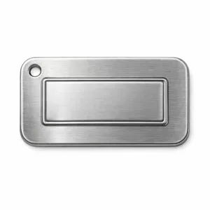 Die-cast bag tag emblem crafted from brushed stainless steel, featuring an embossed blank logo panel, rounded corners, and a single hole for chain attachment. Designed with high durability and a premium metallic look.