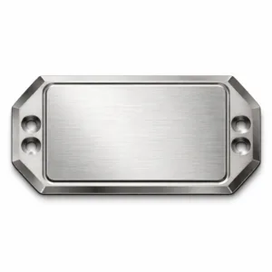 A brushed stainless steel die-cast garment logo plate featuring a beveled edge and two sewing holes. The blank emblem is raised for a clean, modern look. Studio-lit for high realism, perfect for e-commerce product imagery.
