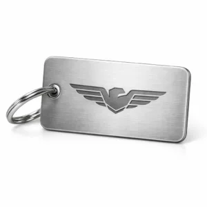 A premium brushed stainless steel effect luggage tag featuring rounded corners and a subtle laser engraved blank emblem, attached to a split ring for easy use. Ideal for travel with a sleek modern design.