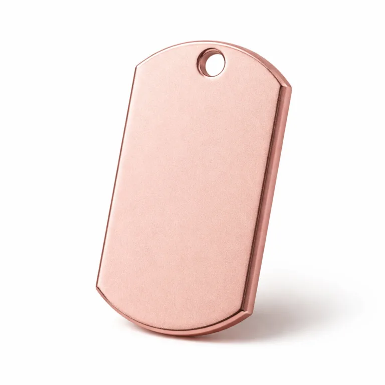 A sharp studio product photo of a matte rose gold anodized aluminum dog tag, sandblasted for a fine texture. Features a beveled edge and a single hole for attaching a chain. Displayed on a crisp white backdrop.