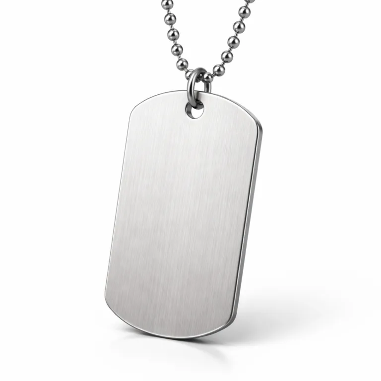 A double-sided dog tag made from brushed stainless steel, featuring softly rounded corners for comfort and a classic ball chain. The clean surface is ideal for engraving, with a subtle metallic grain and high-quality studio lighting.