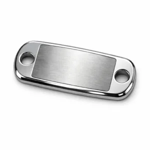 A sportswear metal brand tag made from brushed stainless steel. Features mirror polished rounded edges, double sewing holes for attachment, and a blank emblem design laser engraved at its center. Photographed on white for e-commerce use.