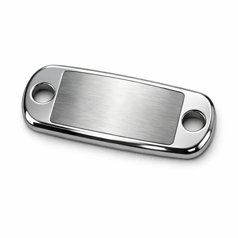 A sportswear metal brand tag made from brushed stainless steel. Features mirror polished rounded edges, double sewing holes for attachment, and a blank emblem design laser engraved at its center. Photographed on white for e-commerce use.