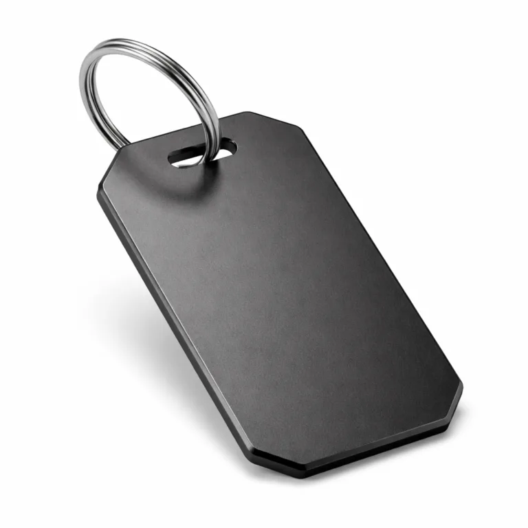 A sleek luggage tag made from matte anodized aluminum with a contemporary beveled edge, enhancing both aesthetics and durability. Comes with a split ring for easy attachment, photographed for crisp e-commerce presentation.