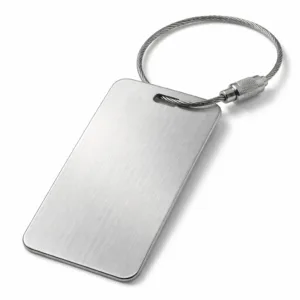 A heavy-duty luggage tag crafted from brushed stainless steel with a smooth, brushed finish and rounded corner design. Features a split ring for secure attachment to luggage. Photographed in high realism on a white background for e-commerce display.