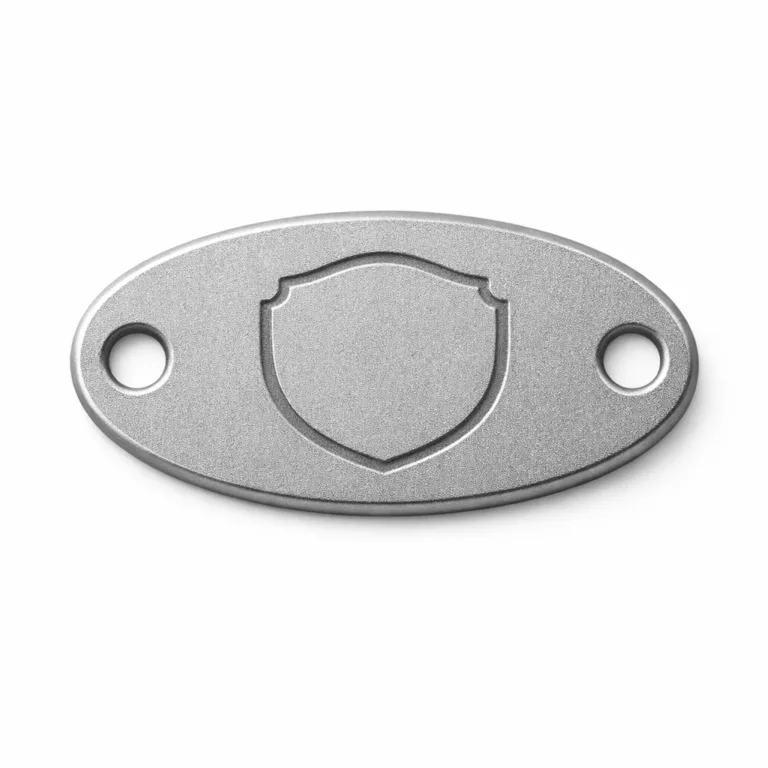 High-quality oval keychain tag with a sandblasted matte anodized aluminum look, features double holes for secure split ring fitting and an etched blank emblem for personalization.
