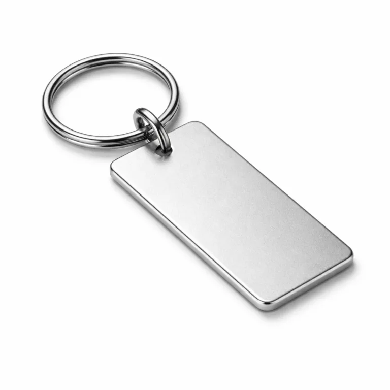 A rectangular anodized aluminum keychain tag with sandblasted matte surface and smooth beveled edges, displayed with a split ring attachment, captured in a crisp studio product photo.