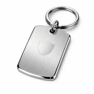 A premium keychain tag manufactured from brushed stainless steel, featuring a mirror polished beveled edge for a sleek look. The tag is attached with a split ring, and includes a subtle blank emblem engraving for customization.