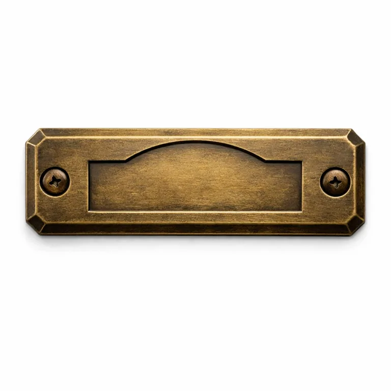 A premium antique brass logo tag featuring a chamfered edge for classic appeal, debossed emblem area for subtle branding, and two screw holes for permanent mounting.