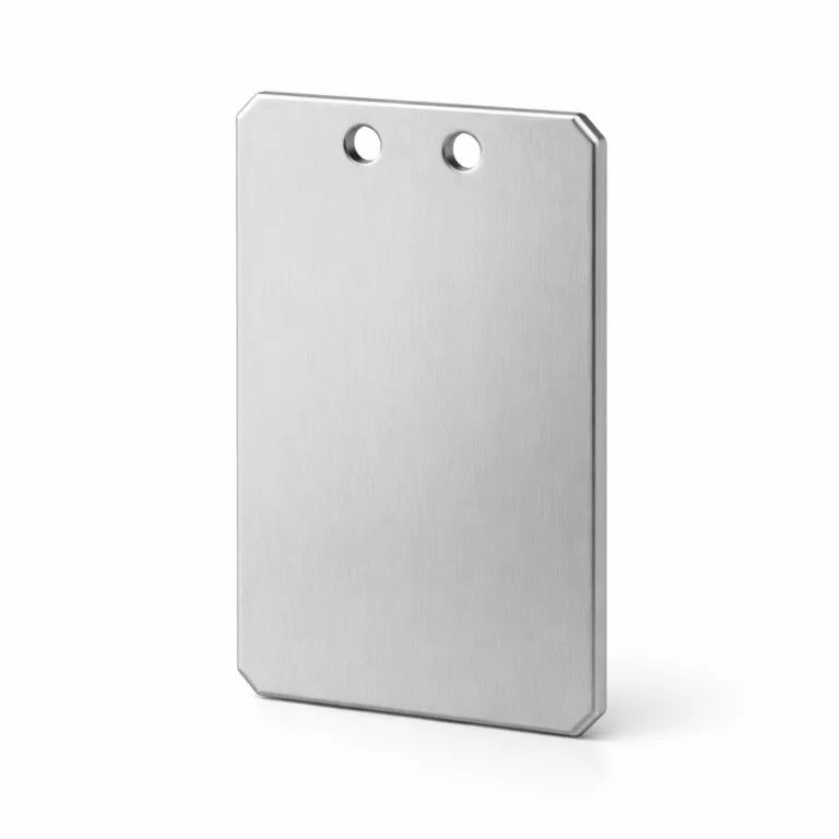 A brushed anodized aluminum luggage tag with a matte silver finish and distinct beveled edge. Features double holes for versatile attachment, shown without a split ring. Shot in high detail on a white studio background for commercial use.