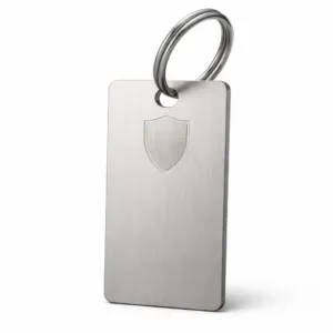 A modern bag tag crafted from brushed stainless steel with a matte nickel finish. Features a single hole for easy attachment, subtle emblem engraving, and a stylish, durable appearance.