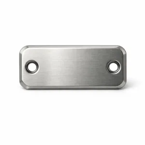 A metal logo tag crafted from brushed stainless steel with a matte nickel finish. The tag features a laser-engraved emblem, beveled edges, and double rivet holes for secure attachment.