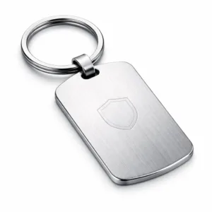 A brushed stainless steel keychain tag featuring rounded corners, attached to a split ring. Subtle laser engraved blank emblem adds detail, making it highly durable and sleek for everyday use.