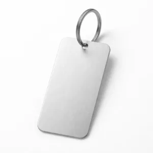 A slim luggage tag crafted from lightweight aluminum with a finely brushed matte surface and rounded corners. It features a single hole with a split ring attachment. The image displays sharp details, ideal for showcasing the product’s clean, modern look.