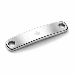 A mirror polished stainless steel bracelet tag with a rounded rectangular shape, double holes for attachment, and a subtle blank emblem engraving. Captured with sharp details and commercial lighting on a white background.
