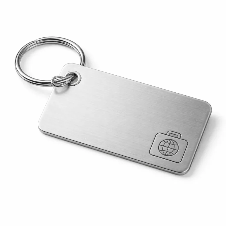 A modern brushed stainless steel luggage tag with rounded corners and a durable split ring. The surface features clean laser engraving for a sleek, premium look.