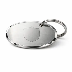 Brushed stainless steel oval luggage tag featuring a mirror polished beveled edge, central blank laser engraved emblem, and a durable stainless split ring for attachment.