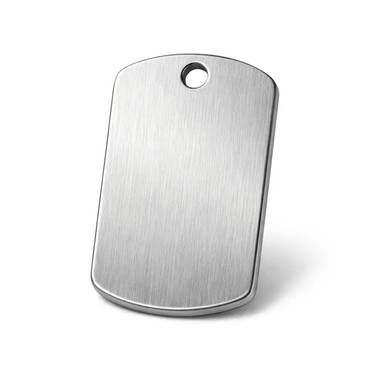 A durable brushed stainless steel dog tag featuring rounded corners for comfort and a single hole designed for attachment with a ball chain. The brushed finish gives it a contemporary, understated look perfect for engraving.