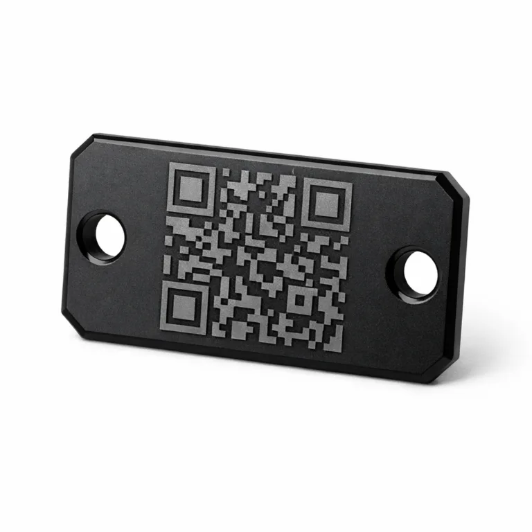 This keychain tag variant is made from matte black anodized aluminum with dual attachment holes and a sharply etched QR code design. The beveled edge adds a subtle highlight to the sleek, contemporary look.