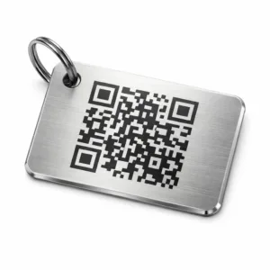 A premium luggage tag made from brushed stainless steel, featuring a beveled edge, rounded corners, and a precision laser engraved QR code. Includes a single hole for split ring attachment, ideal for durable identification.