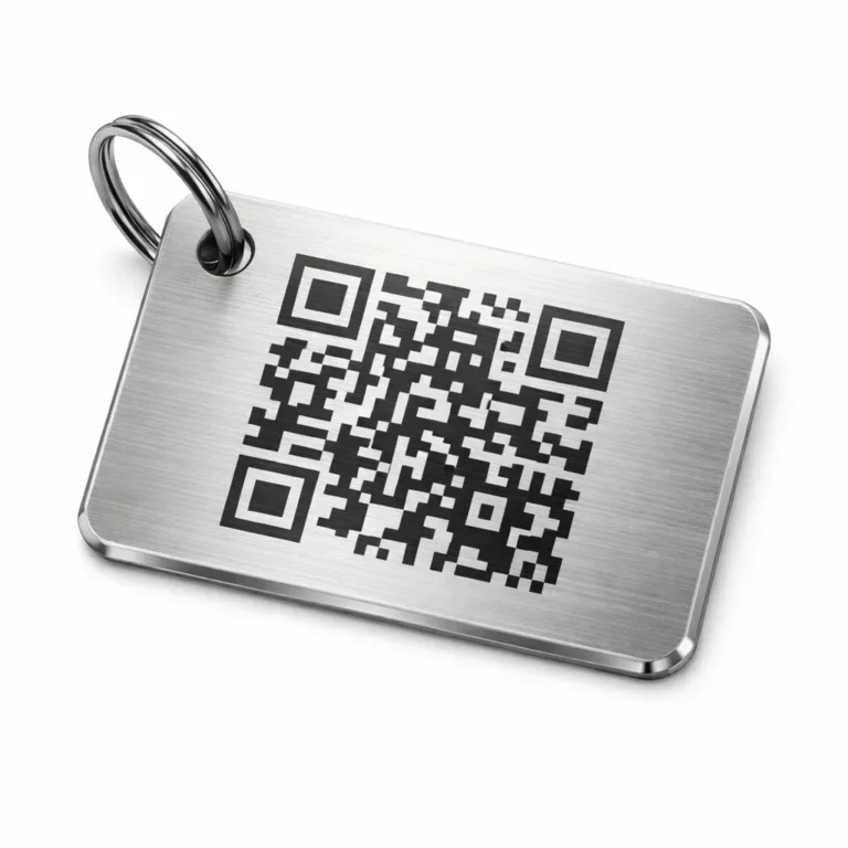 A premium luggage tag made from brushed stainless steel, featuring a beveled edge, rounded corners, and a precision laser engraved QR code. Includes a single hole for split ring attachment, ideal for durable identification.