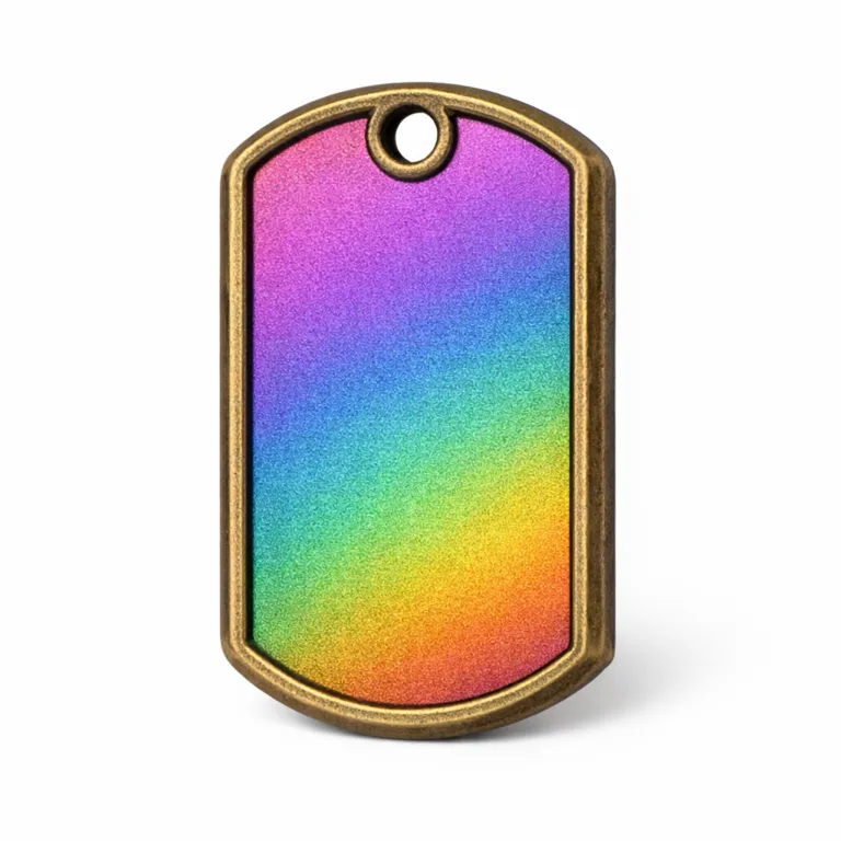 A zinc alloy dog tag with antique brass rainbow PVD plating, sandblasted matte texture, chamfered edges, and a single hole for a split ring attachment. Displayed in a sharp, high-detail white background studio shot.