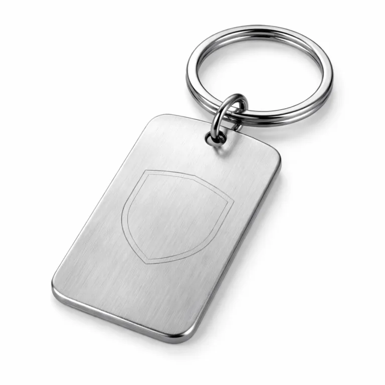 A realistic photo of a brushed stainless steel rectangle keychain tag, featuring rounded corners and a subtle laser engraved blank emblem shape. Attached to a split ring, perfect for modern and durable key identification.