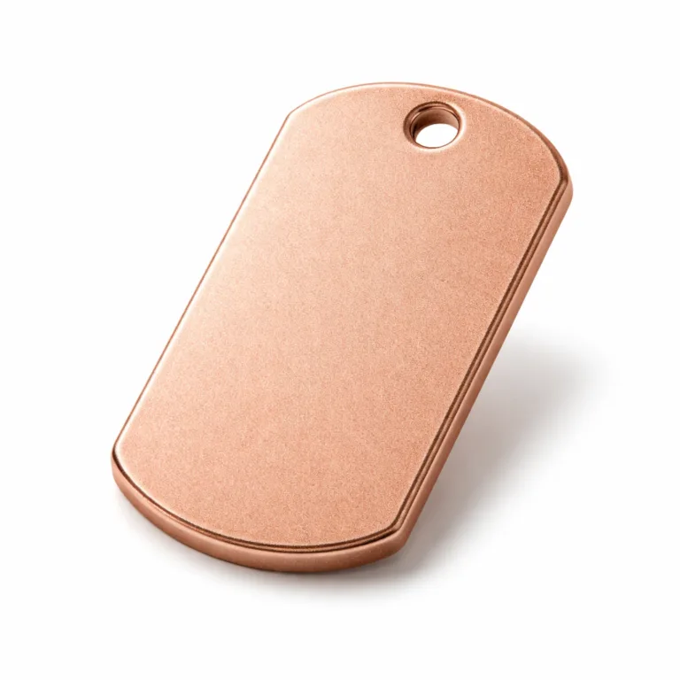 An antique brass finished bag tag with a sandblasted matte texture and noticeably thicker profile. It includes a single hole at one end for attaching a chain, creating a vintage and robust look for luggage or bags.