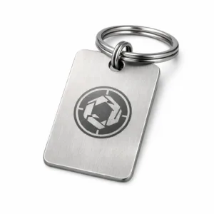 Serial Number Key Tag constructed from brushed stainless steel, featuring rounded corners and an elegant laser-engraved blank emblem design. Includes a sturdy split ring for convenient attachment.