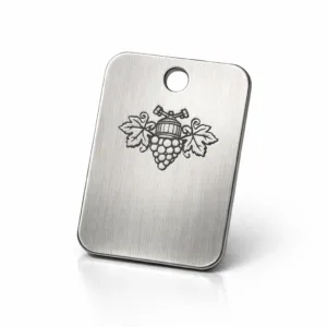 A brushed stainless steel serial number wine tag with rounded corners, single hole for chain attachment, and a laser engraved emblem area. The photo is highly detailed and studio-lit for an e-commerce ready presentation.