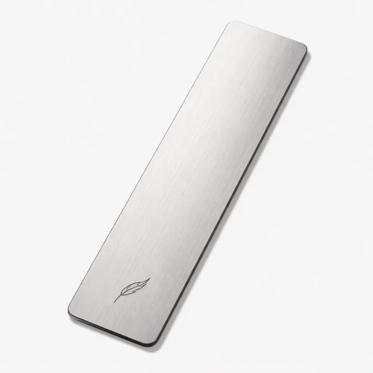 A slim rectangular bookmark crafted from brushed stainless steel, featuring softly rounded corners and a laser engraved emblem detail for a refined, modern appearance. The brushed texture and clean edges give it a durable and premium look, perfect for durable use as a stylish marker.