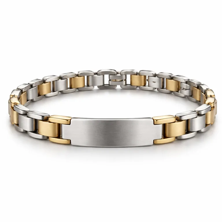A two-tone bracelet tag featuring brushed stainless steel and polished brass, accented with subtle rounded corners and a laser engraved blank emblem at the center. Displays a clean, modern finish in a studio photo.
