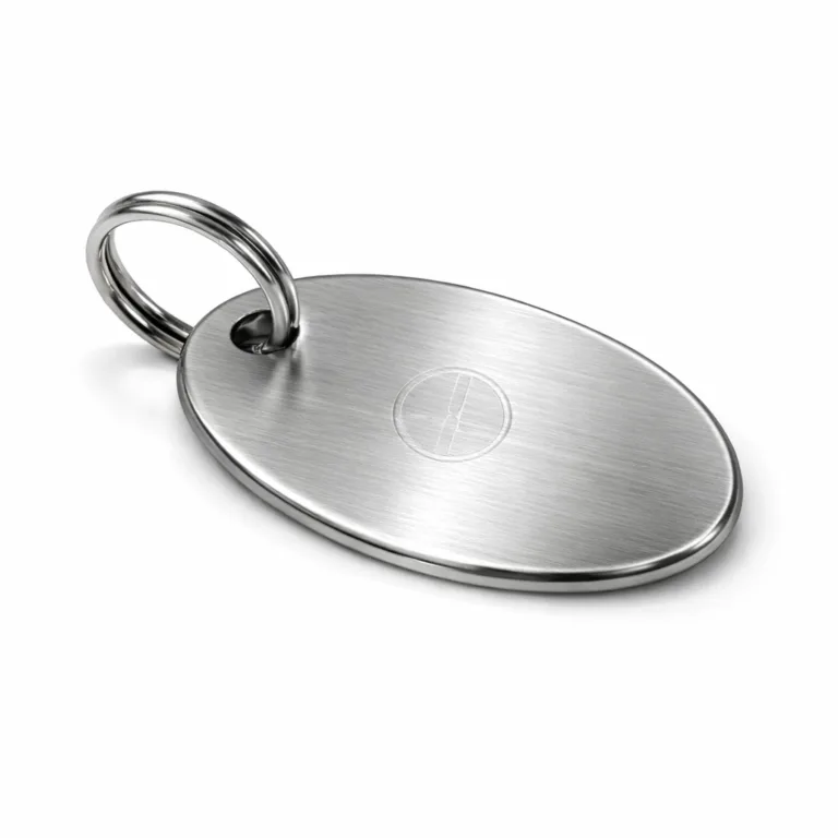 Elegant wine gift message tag crafted from brushed stainless steel. Features an oval design, split ring for easy hanging, and a subtle laser engraved blank emblem for custom branding.