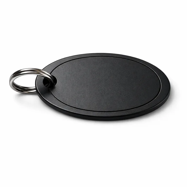 Modern wine gift message tag made from matte black anodized aluminum. Oval tag design, split ring attachment, and an etched blank emblem area deliver a striking contemporary look.