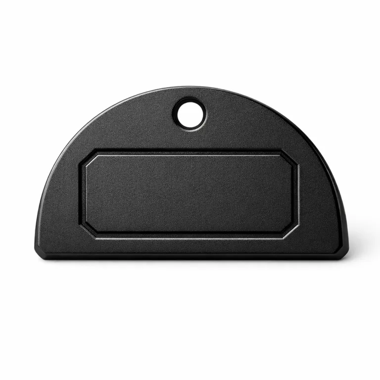 Product photo featuring a wine tag made of zinc alloy with a sandblasted matte black nickel finish, chamfered edges, and a debossed blank emblem area. Includes a single hole for suspension, providing a modern touch for wine bottles.